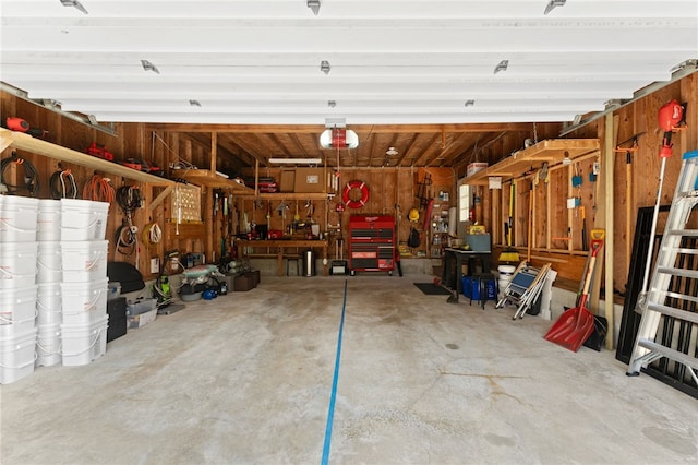 336 Switch Rd, Richmond, RI 02832 - garage with a workshop area and a garage door opener