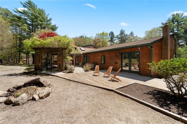 336 Switch Rd, Richmond, RI 02832 - rear view of property with french doors, a wooden deck, and a chimney