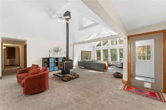 336 Switch Rd, Richmond, RI 02832 - living room featuring carpet, a wood stove, high vaulted ceiling, beamed ceiling, and a ceiling fan