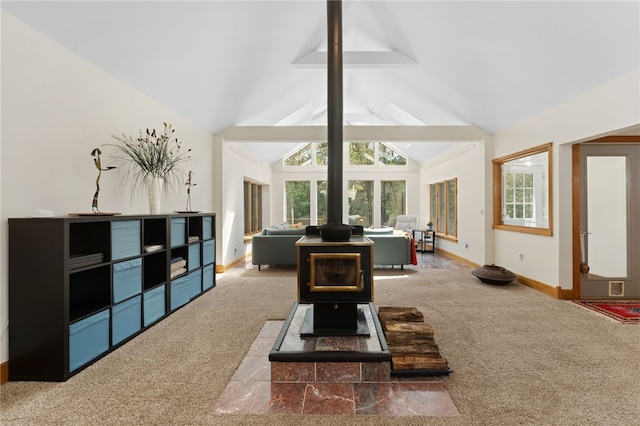 336 Switch Rd, Richmond, RI 02832 - living room with carpet floors, healthy amount of natural light, and a wood stove