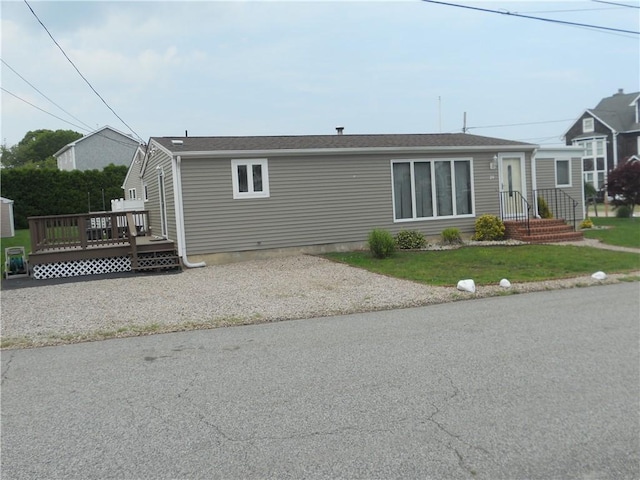 20 Anchorage Rd, Narragansett, RI 02882 - back of property with a wooden deck and a lawn