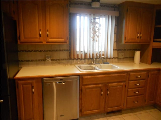 20 Anchorage Rd, Narragansett, RI 02882 - kitchen featuring stainless steel appliances, a sink, light countertops, brown cabinetry, and tasteful backsplash