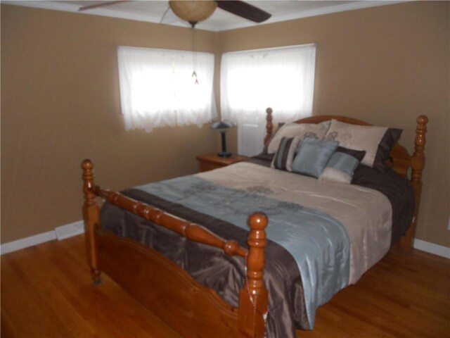 20 Anchorage Rd, Narragansett, RI 02882 - bedroom featuring baseboards, wood finished floors, multiple windows, and ornamental molding