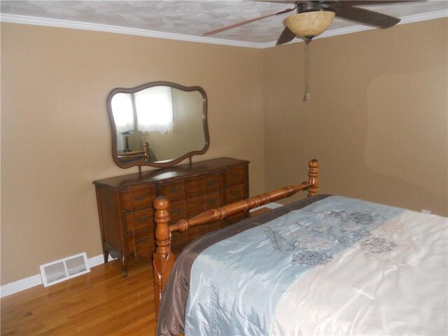 20 Anchorage Rd, Narragansett, RI 02882 - bedroom with wood finished floors, ornamental molding, baseboards, and a ceiling fan