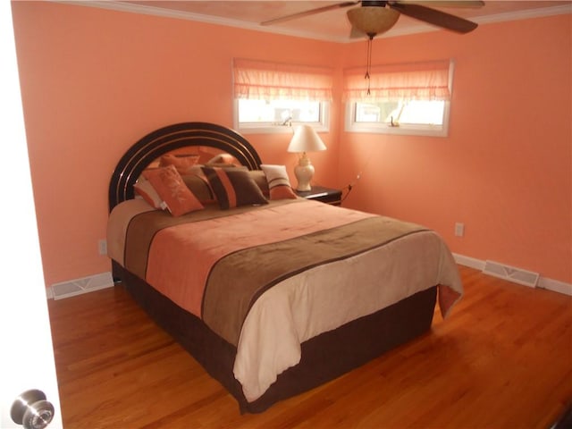 20 Anchorage Rd, Narragansett, RI 02882 - bedroom with wood finished floors, baseboards, crown molding, and multiple windows