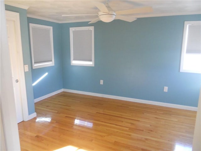 20 Anchorage Rd, Narragansett, RI 02882 - spare room with light wood-type flooring, ornamental molding, ceiling fan, and baseboards