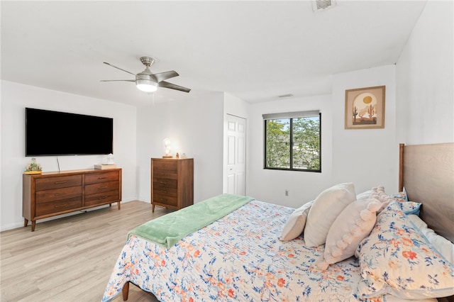 694 Orleans Ct, Warwick, RI 02886 - bedroom with light wood-style flooring, ceiling fan, and a closet