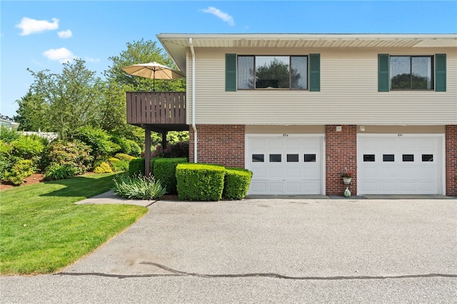 694 Orleans Ct, Warwick, RI 02886 - view of front of house featuring brick siding, driveway, an attached garage, and a front yard