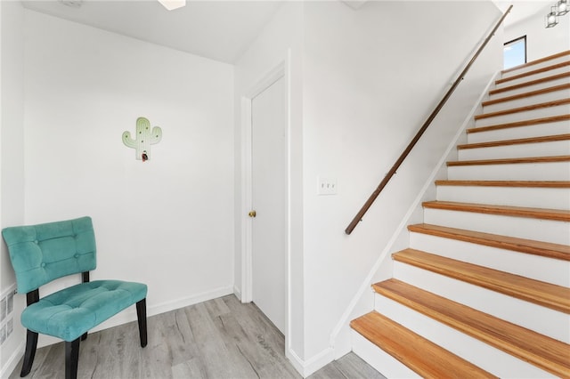 694 Orleans Ct, Warwick, RI 02886 - sitting room featuring light wood-type flooring, stairway, and baseboards