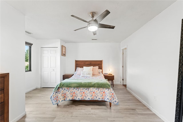 694 Orleans Ct, Warwick, RI 02886 - bedroom featuring light wood-style flooring, baseboards, a ceiling fan, and a closet