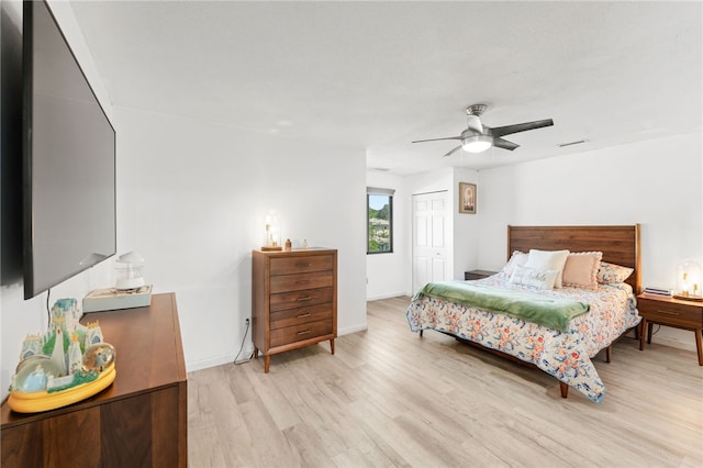 694 Orleans Ct, Warwick, RI 02886 - bedroom featuring light wood-style flooring, a closet, a ceiling fan, and baseboards