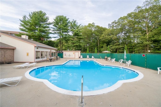 752 Quaker Ln Unit C311, Warwick, RI 02818 - community pool featuring a patio and view of scattered trees