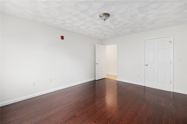752 Quaker Ln Unit C311, Warwick, RI 02818 - unfurnished bedroom with baseboards and wood finished floors