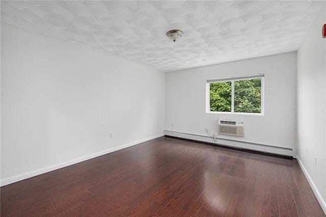 752 Quaker Ln Unit C311, Warwick, RI 02818 - unfurnished room featuring a baseboard heating unit, hardwood / wood-style floors, and a wall mounted air conditioner