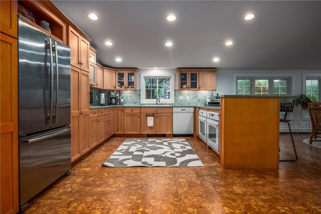 2 Cherry Ln, Bristol, RI 02809 - kitchen featuring white appliances, recessed lighting, backsplash, a sink, and glass insert cabinets