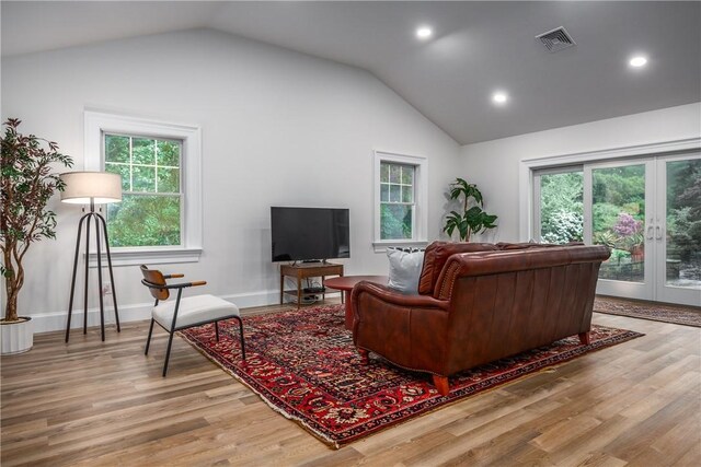 2 Cherry Ln, Bristol, RI 02809 - living room featuring lofted ceiling, wood finished floors, french doors, recessed lighting, and baseboards
