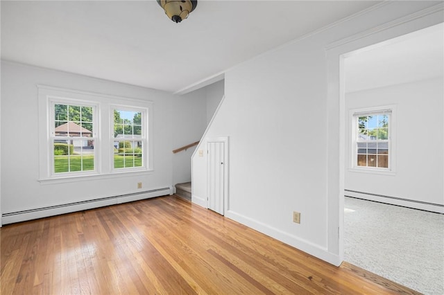 52 Pleasant View Rd, Warwick, RI 02888 - empty room featuring baseboard heating, stairs, and healthy amount of natural light