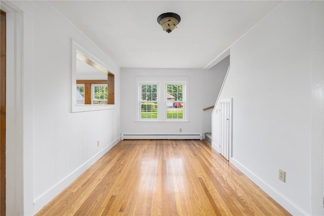 52 Pleasant View Rd, Warwick, RI 02888 - empty room featuring light wood finished floors, baseboards, and baseboard heating