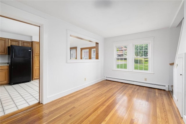 52 Pleasant View Rd, Warwick, RI 02888 - spare room with a baseboard radiator, light wood-type flooring, and baseboards