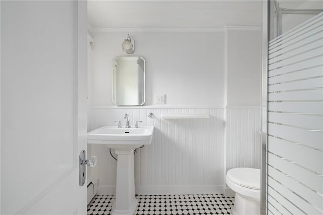 52 Pleasant View Rd, Warwick, RI 02888 - bathroom with toilet, wainscoting, ornamental molding, and a sink