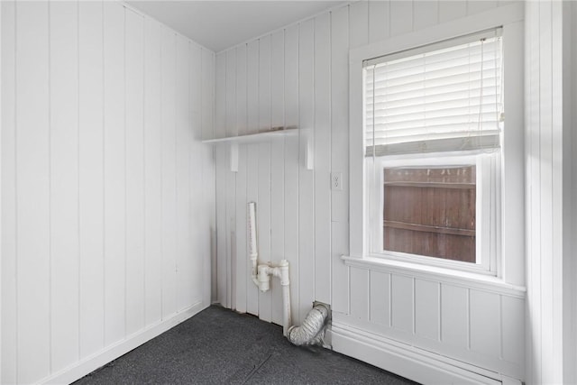 52 Pleasant View Rd, Warwick, RI 02888 - laundry room featuring dark carpet and wooden walls
