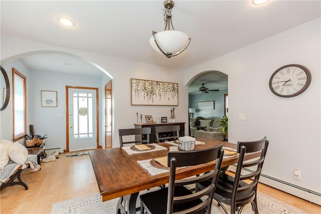 2 Ann St, North Providence, RI 02904 - dining room with arched walkways, light wood-style floors, a ceiling fan, a baseboard heating unit, and recessed lighting