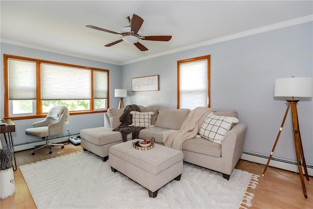 2 Ann St, North Providence, RI 02904 - living room with a baseboard heating unit, ornamental molding, a ceiling fan, and wood finished floors