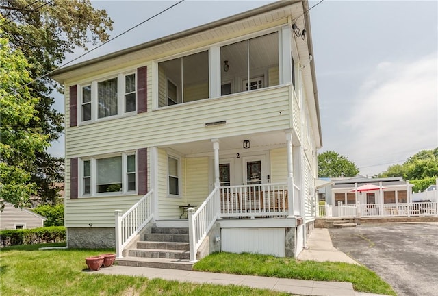 2 Ann St, North Providence, RI 02904 - view of front of property featuring covered porch and driveway