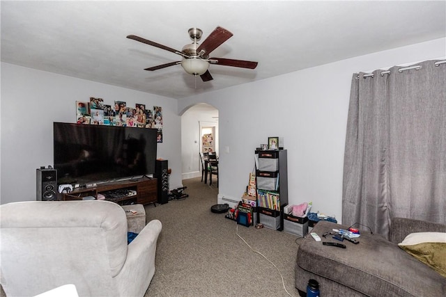 2 Ann St, North Providence, RI 02904 - carpeted living room with arched walkways, ceiling fan, and a baseboard radiator