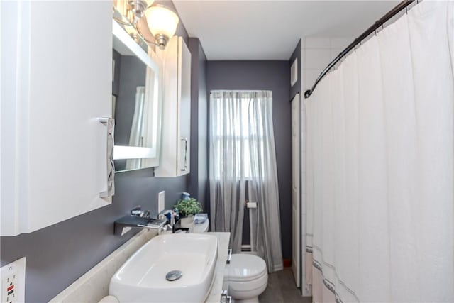 2 Ann St, North Providence, RI 02904 - bathroom featuring toilet, a shower with curtain, and a sink
