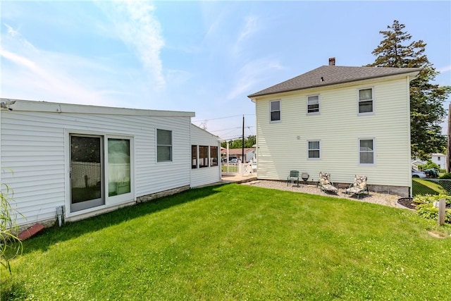 2 Ann St, North Providence, RI 02904 - rear view of house with a yard and a chimney