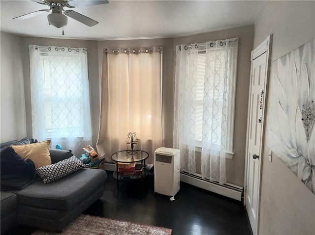 5 Peter St, Providence, RI 02904 - sitting room featuring a baseboard heating unit, a ceiling fan, and wood finished floors