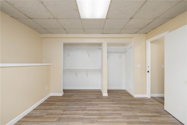 259 Buttonwoods Ave, Warwick, RI 02886 - unfurnished bedroom featuring a closet, wood finished floors, and baseboards