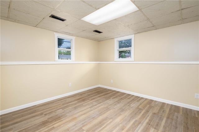 259 Buttonwoods Ave, Warwick, RI 02886 - basement featuring wood finished floors, baseboards, and a drop ceiling