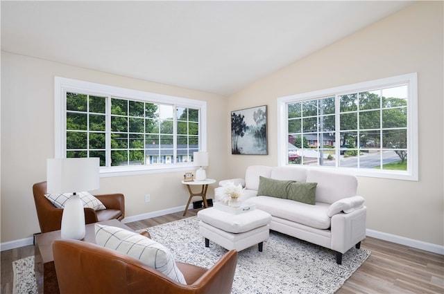 259 Buttonwoods Ave, Warwick, RI 02886 - living area featuring wood finished floors, lofted ceiling, and baseboards