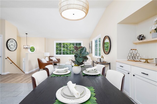 259 Buttonwoods Ave, Warwick, RI 02886 - dining room featuring light wood-style floors, lofted ceiling, and baseboards
