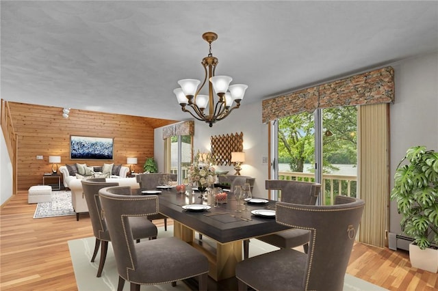 236 Indian Trl, Narragansett, RI 02874 - dining space featuring wood walls, plenty of natural light, a chandelier, and light wood-style flooring
