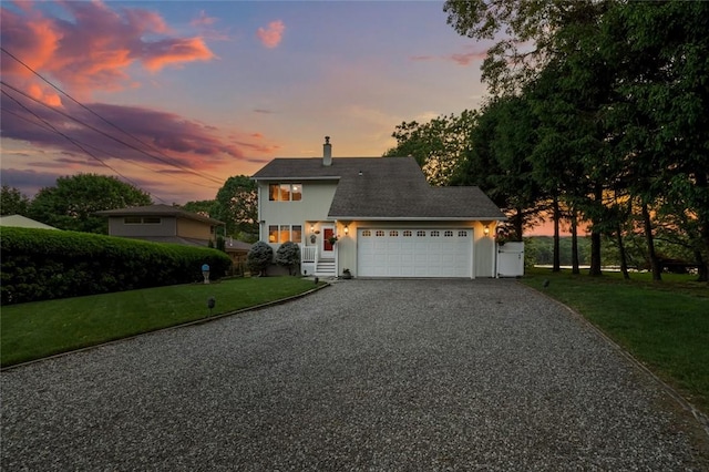 236 Indian Trl, Narragansett, RI 02874 - view of front facade featuring gravel driveway, a yard, a garage, and a chimney