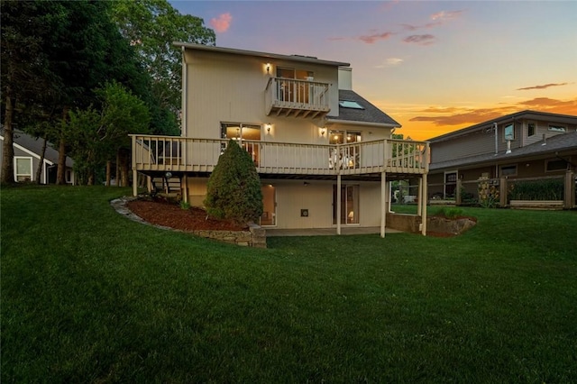 236 Indian Trl, Narragansett, RI 02874 - back of property at dusk featuring a lawn, a wooden deck, a patio, and a balcony