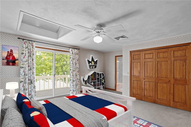 236 Indian Trl, Narragansett, RI 02874 - bedroom featuring wallpapered walls, access to outside, a textured ceiling, attic access, and carpet flooring