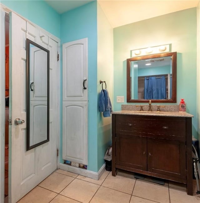 263 Front St, Lincoln, RI 02865 - bathroom featuring tile patterned flooring, vanity, and baseboards