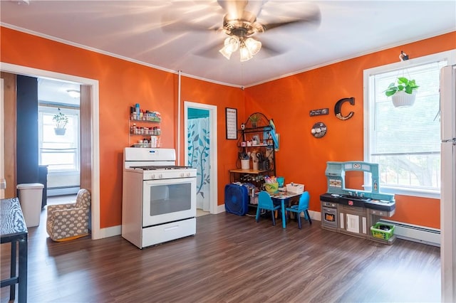 263 Front St, Lincoln, RI 02865 - kitchen featuring white gas stove, dark wood finished floors, a baseboard heating unit, a ceiling fan, and crown molding
