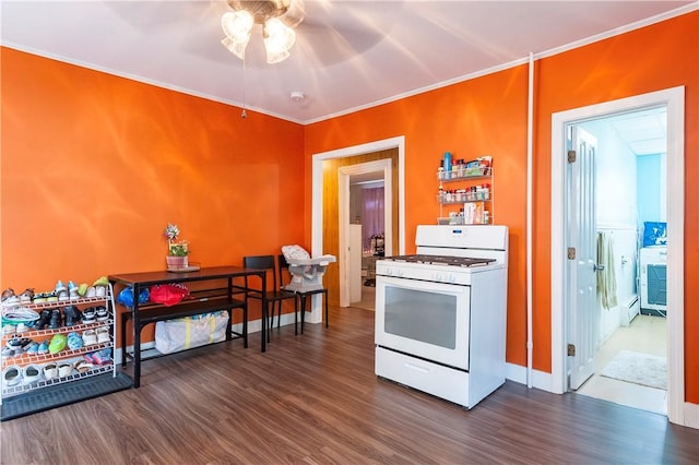 263 Front St, Lincoln, RI 02865 - kitchen with white gas range, ceiling fan, dark wood finished floors, a baseboard heating unit, and ornamental molding