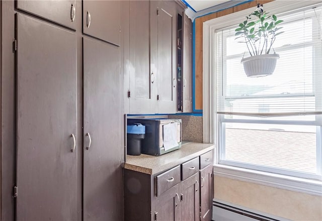 263 Front St, Lincoln, RI 02865 - detailed view of a baseboard heating unit and light countertops