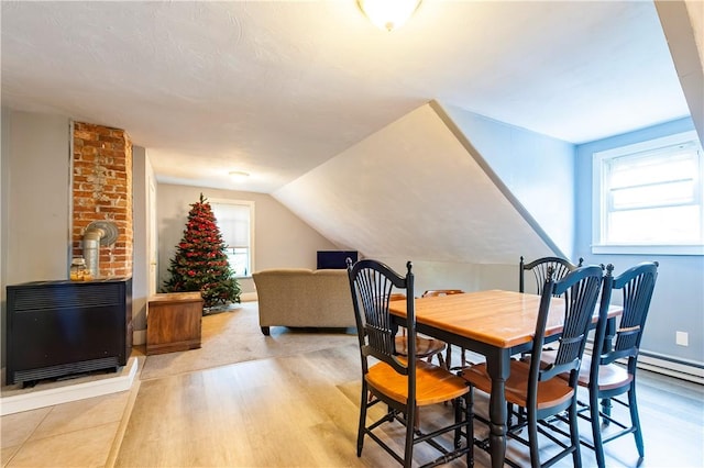 263 Front St, Lincoln, RI 02865 - dining space featuring light wood-style flooring, heating unit, and lofted ceiling