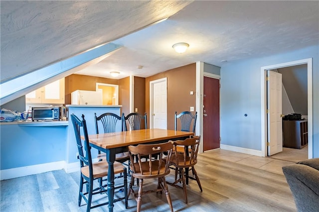 263 Front St, Lincoln, RI 02865 - dining room featuring wood finished floors and baseboards