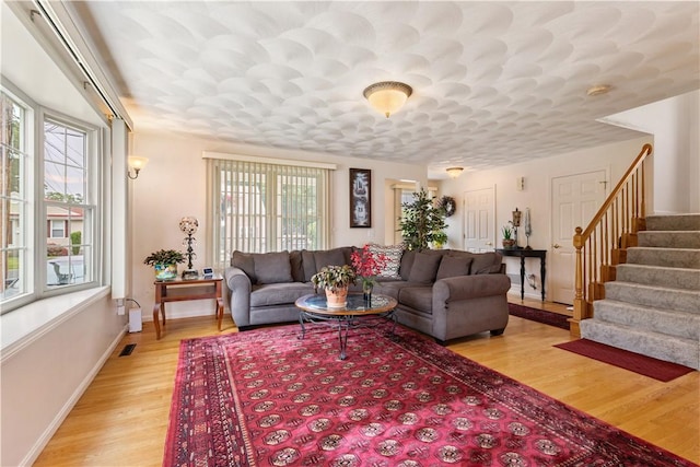 53 Hyde Ave, Pawtucket, RI 02861 - living room with plenty of natural light, light wood-style floors, and stairway