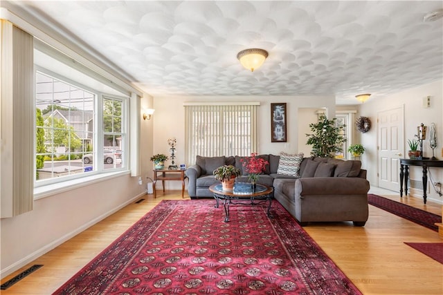 53 Hyde Ave, Pawtucket, RI 02861 - living room with light wood-style floors and baseboards