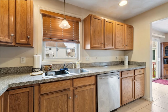 53 Hyde Ave, Pawtucket, RI 02861 - kitchen featuring stainless steel dishwasher, a sink, light tile patterned floors, and brown cabinets