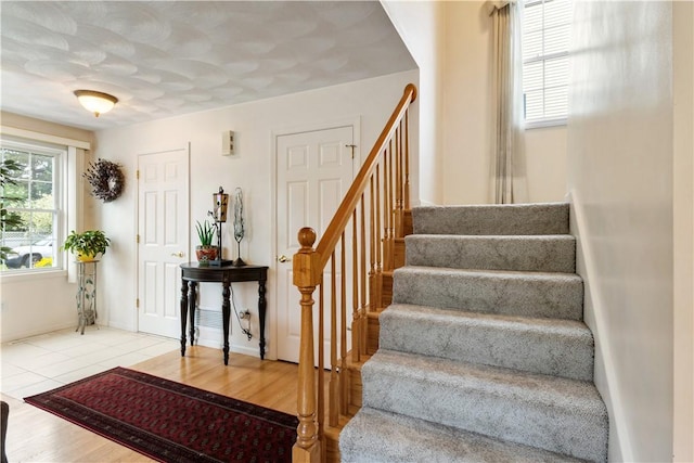 53 Hyde Ave, Pawtucket, RI 02861 - foyer entrance with stairway and wood finished floors